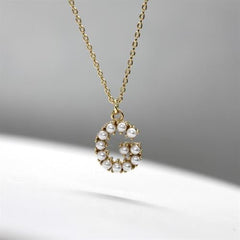 Sarı Altın 14 Ayar İncili G Harfi Sarı Altın 14 Ayar İncili G Harfi - Tac diamond - Sarı altın - inci kolye - pırlanta - kolye -pırlanta kolye - inci kolye - kolye - kolyeler - altın kolye modelleri